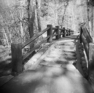 black and white photo of a bridge with steps