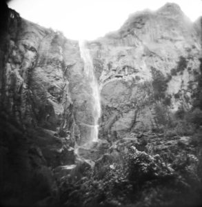 black and white photo of a waterfall