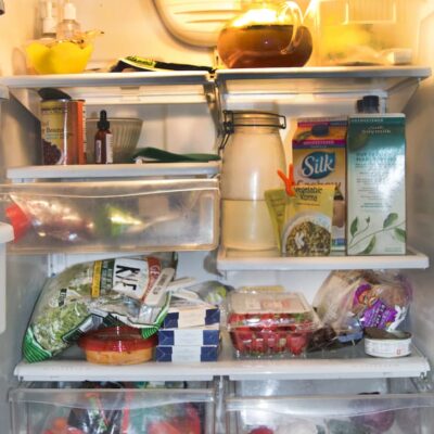 Fridge with milk and vegetables